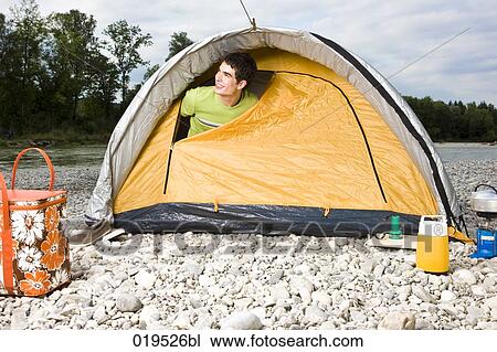young man peeking through tent in the morning View Large Photo Image Stock Image - young man peeking through tent in the morning. Fotosearch