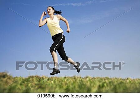 young woman jogging in park View Large Photo Image Stock Image - young woman jogging in park. Fotosearch