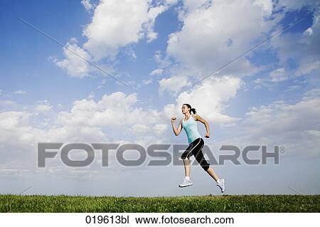 young woman jogging in park View Large Photo Image Stock Image - young woman jogging in park. Fotosearch