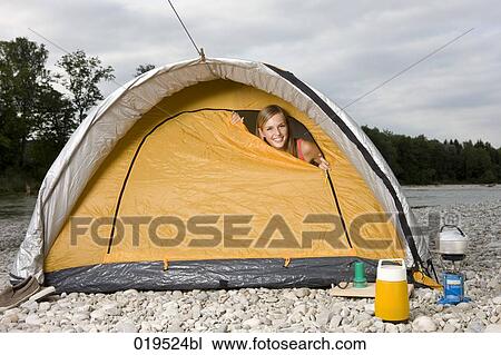 young woman peeking through tent in the morning View Large Photo Image Stock Image - young woman peeking through tent in the morning. Fotosearch