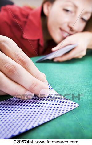 young woman peeping at playing card View Large Photo Image Stock Image - young woman peeping at playing card. Fotosearch