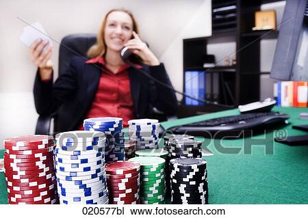 young woman sitting in front of computer with poker equipment talking on telephone View Large Photo Image Stock Image - young woman sitting in front of computer with poker equipment talking on telephone. Fotosearch