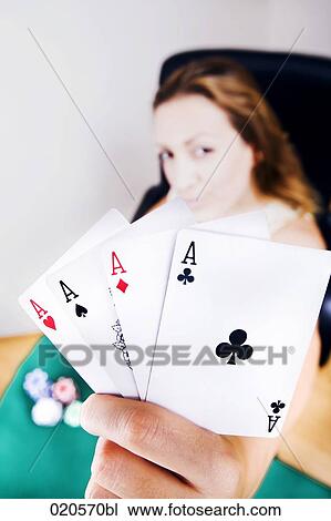 young woman with playing cards showing four aces View Large Photo Image Stock Image - young woman with playing cards showing four aces. Fotosearch