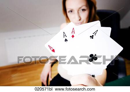 young woman with playing cards showing four aces View Large Photo Image Stock Image - young woman with playing cards showing four aces. Fotosearch