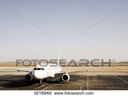 Stock Image - airplane on runway. Fotosearch