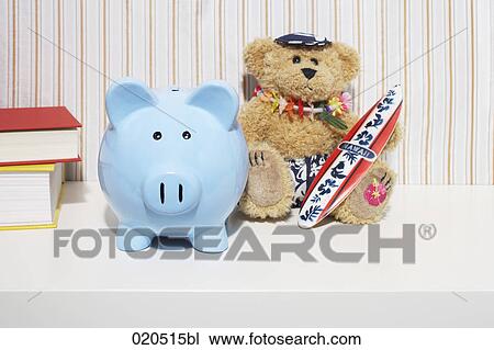 blue piggybank and teddy bear on shelf View Large Photo Image Stock Image - blue piggybank and teddy bear on shelf. Fotosearch