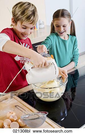 brother and sister mixing dough in bowl together View Large Photo Image Stock Image - brother and sister mixing dough in bowl together. Fotosearch