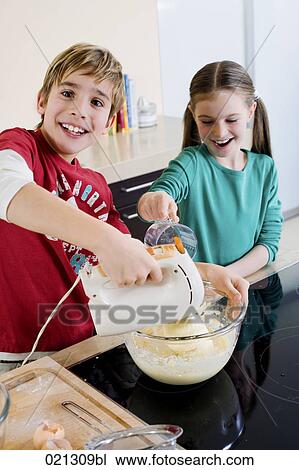 brother and sister mixing dough in bowl together View Large Photo Image Stock Image - brother and sister mixing dough in bowl together. Fotosearch