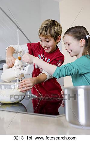 brother and sister mixing dough in bowl together View Large Photo Image Stock Image - brother and sister mixing dough in bowl together. Fotosearch