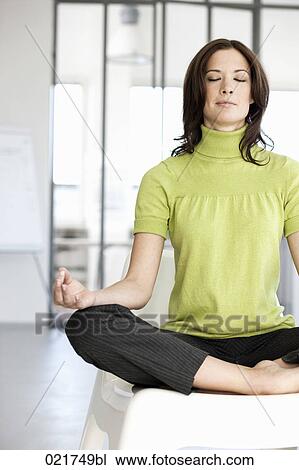 businesswoman doing yoga in office View Large Photo Image Stock Image - businesswoman doing yoga in office. Fotosearch
