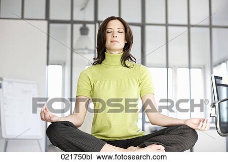businesswoman doing yoga in office View Large Photo Image Stock Image - businesswoman doing yoga in office. Fotosearch
