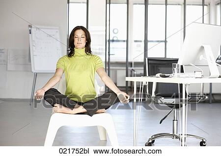 businesswoman doing yoga in office View Large Photo Image Stock Image - businesswoman doing yoga in office. Fotosearch