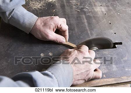 close-up of carpenter cutting piece of wood with buzz saw View Large Photo Image Stock Image - close-up of carpenter cutting piece of wood with buzz saw. Fotosearch