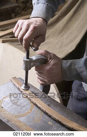 close-up of carpenter fixing piece of wood with hand-vice View Large Photo Image Stock Image - close-up of carpenter fixing piece of wood with hand-vice. Fotosearch
