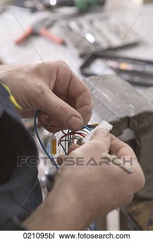 close-up of mechanic repairing cables View Large Photo Image Stock Image - close-up of mechanic repairing cables. Fotosearch