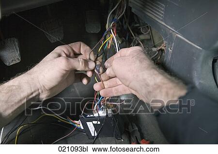 close-up of mechanic repairing car electronic View Large Photo Image Stock Image - close-up of mechanic repairing car electronic. Fotosearch