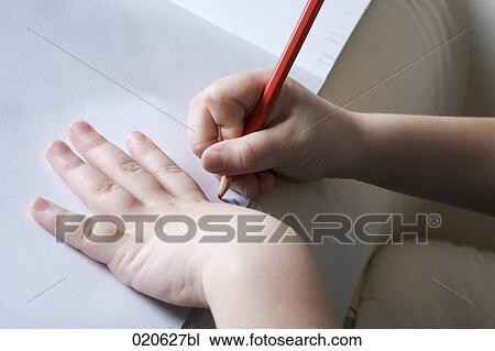 close-up of young girl drawing on paper View Large Photo Image Stock Image - close-up of young girl drawing on paper. Fotosearch