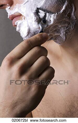 close-up of young man shaving View Large Photo Image Stock Image - close-up of young man shaving. Fotosearch