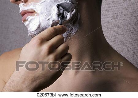 close-up of young man shaving View Large Photo Image Stock Image - close-up of young man shaving. Fotosearch