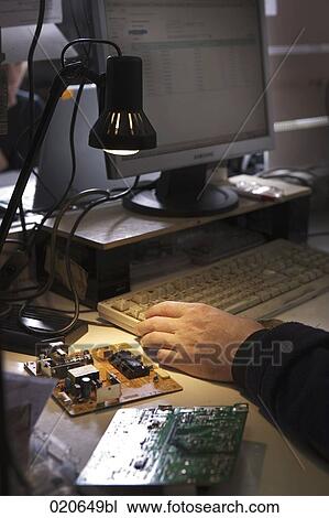 detail of worker at computer repair shop testing spare parts View Large Photo Image Stock Image - detail of worker at computer repair shop testing spare parts. Fotosearch