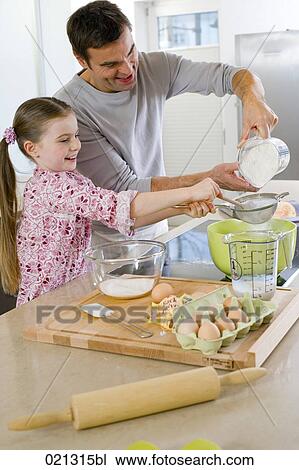 father and daughter making cake together View Large Photo Image Stock Image - father and daughter making cake together. Fotosearch
