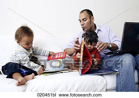 father on sofa with laptop computer playing with his two little sons View Large Photo Image Stock Image - father on sofa with laptop computer playing with his two little sons. Fotosearch