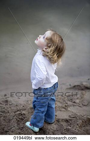 full body portrait of young boy looking up to the sky View Large Photo Image Stock Image - full body portrait of young boy looking up to the sky. Fotosearch