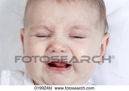 Stock Image - headshot of crying baby. Fotosearch