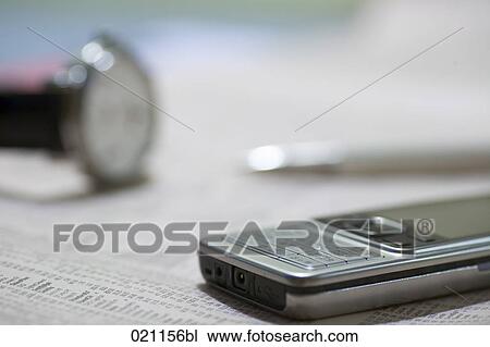 mobile phone on page of business paper View Large Photo Image Stock Image - mobile phone on page of business paper. Fotosearch