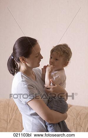 mother holding little son in her arms View Large Photo Image Stock Image - mother holding little son in her arms. Fotosearch
