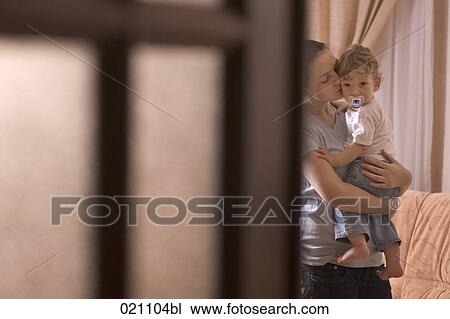 mother holding little son in her arms View Large Photo Image Stock Image - mother holding little son in her arms. Fotosearch