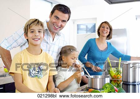 parents cooking with their children in kitchen View Large Photo Image Stock Image - parents cooking with their children in kitchen. Fotosearch