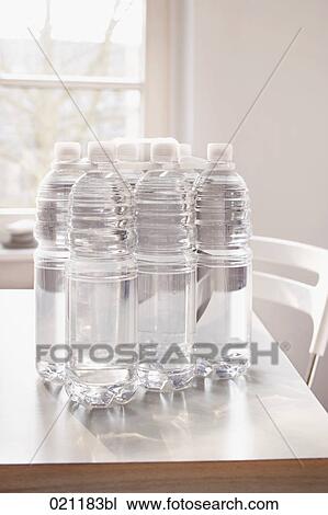 plastic bottles on table View Large Photo Image Stock Image - plastic bottles on table. Fotosearch
