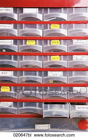 plastic cupboard with spare parts at computer workshop View Large Photo Image Stock Image - plastic cupboard with spare parts at computer workshop. Fotosearch