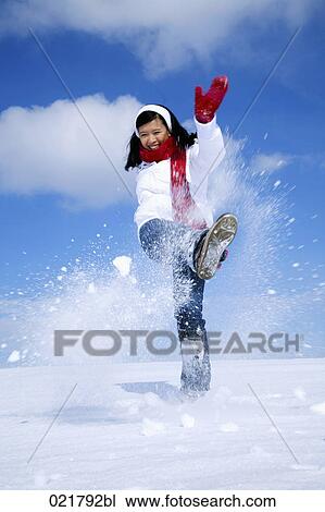portrait of asian woman kicking snow in winter View Large Photo Image Stock Image - portrait of asian woman kicking snow in winter. Fotosearch