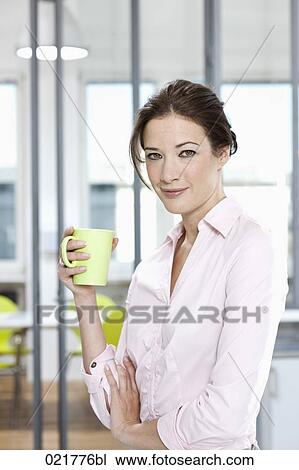 portrait of businesswoman holding mug View Large Photo Image Stock Image - portrait of businesswoman holding mug. Fotosearch