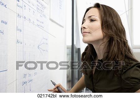portrait of businesswoman in front of whiteboard View Large Photo Image Stock Image - portrait of businesswoman in front of whiteboard. Fotosearch