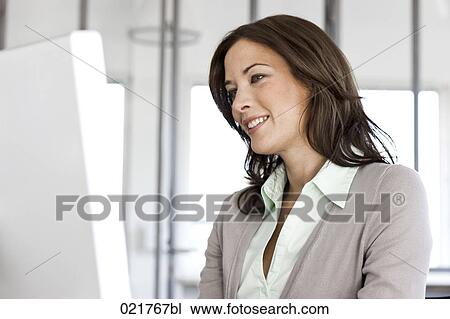 portrait of businesswoman looking at computer screen View Large Photo Image Stock Image - portrait of businesswoman looking at computer screen. Fotosearch