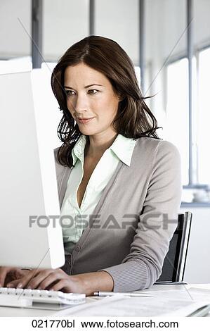 portrait of businesswoman looking at computer screen View Large Photo Image Stock Image - portrait of businesswoman looking at computer screen. Fotosearch