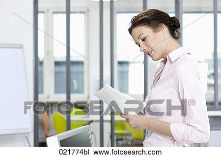 portrait of businesswoman reading documents View Large Photo Image Stock Image - portrait of businesswoman reading documents. Fotosearch