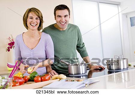 portrait of couple cooking in kitchen together View Large Photo Image Stock Image - portrait of couple cooking in kitchen together. Fotosearch