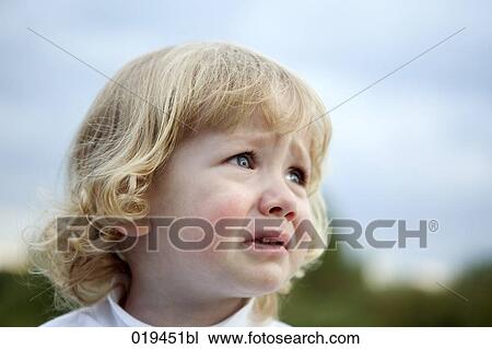 Stock Image - portrait of crying young boy. Fotosearch