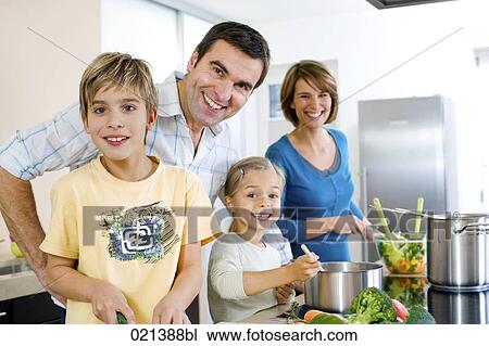 portrait of family cooking together in kitchen View Large Photo Image Stock Image - portrait of family cooking together in kitchen. Fotosearch