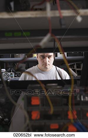 portrait of man working at computer repair shop View Large Photo Image Stock Image - portrait of man working at computer repair shop. Fotosearch