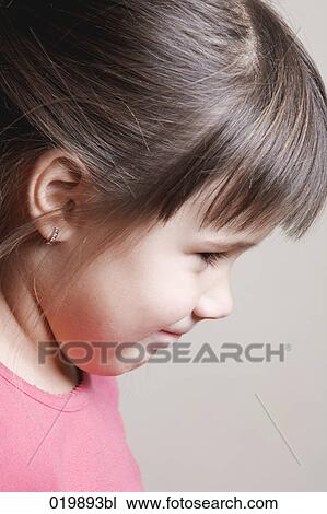 Stock Image - portrait of mischievous young girl. Fotosearch