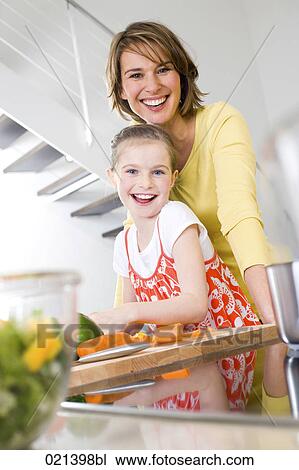 portrait of mother and daughter in kitchen View Large Photo Image Stock Image - portrait of mother and daughter in kitchen. Fotosearch