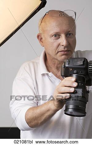 portrait of photographer in his studio View Large Photo Image Stock Image - portrait of photographer in his studio. Fotosearch