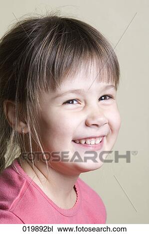 Stock Image - portrait of smiling young girl. Fotosearch