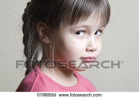 portrait of suspicious young girl View Large Photo Image Stock Image - portrait of suspicious young girl. Fotosearch