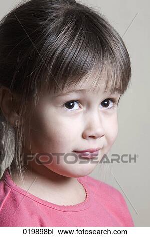 portrait of suspicious young girl View Large Photo Image Stock Image - portrait of suspicious young girl. Fotosearch